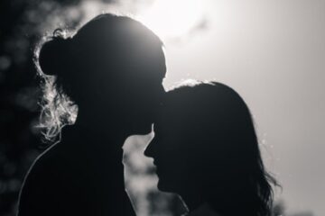 silhouette of couple hugging