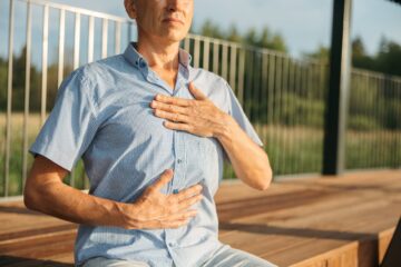 person s hands on his chest