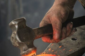 man forging metal